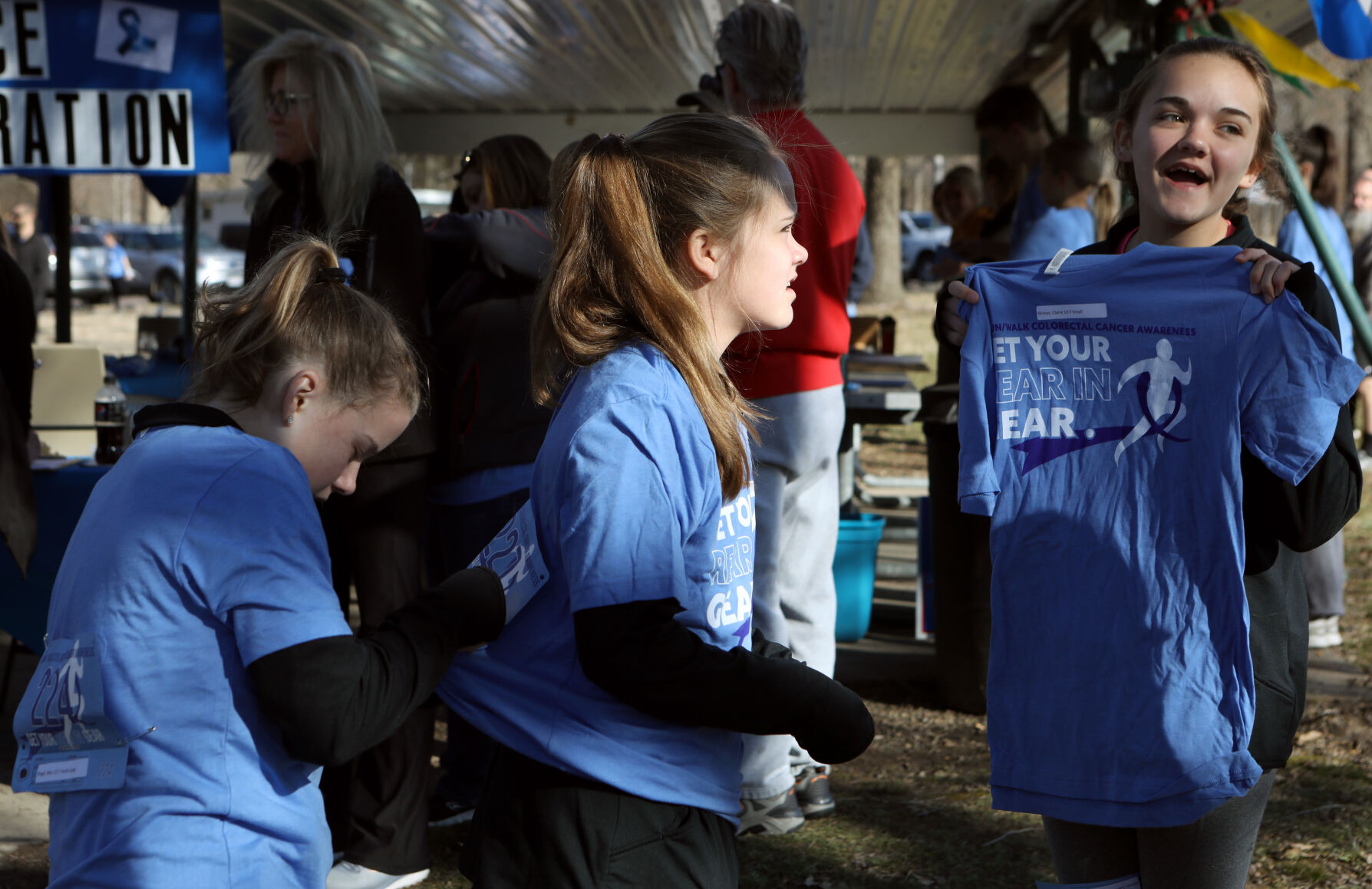 Maya Riegel, Kendal Gilmor and Claire Gilmor prepare for 5K
